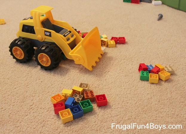 Exploring greater than and less than with construction trucks and blocks