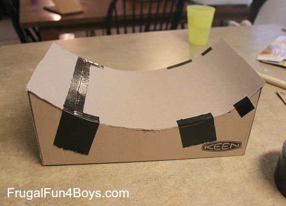 Turn a cardboard box into a jump for hot wheels cars!