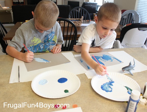 Make some ocean paintings with foil fish!
