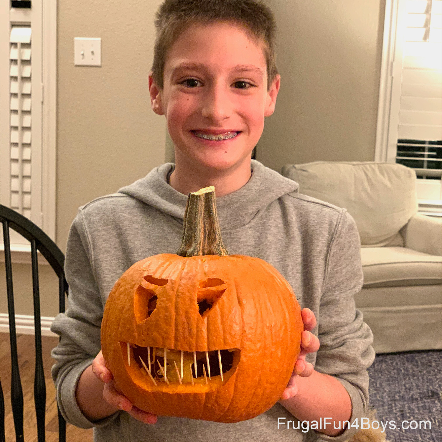 Halloween jokes - a child holding a carved pumpkin