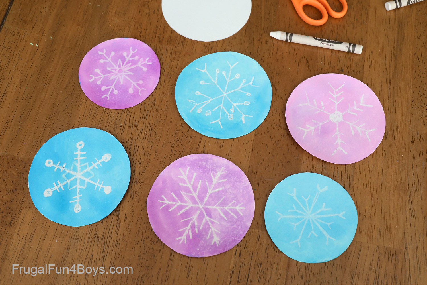 Watercolor and white crayon snowflakes